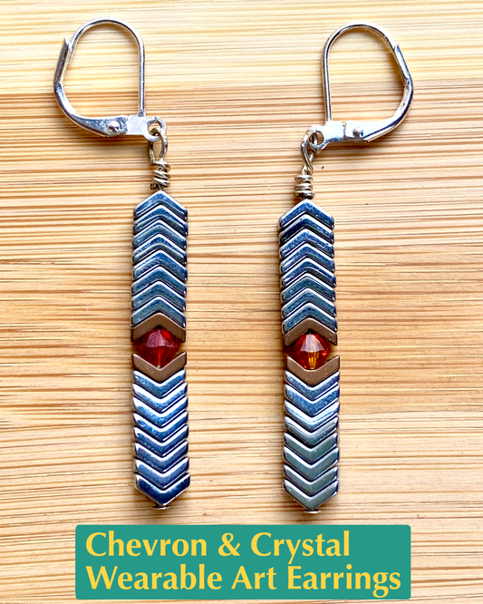 Handmade earrings of brown and silver hematite and red vintage Swarovski crystal beads and white metal.