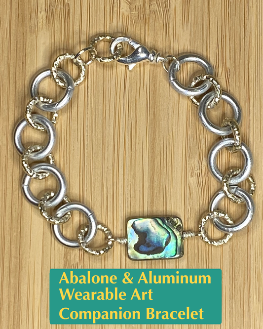 Handmade chain made from silver and gold aluminum, abalone shell charm, and silver brass lobster clasp