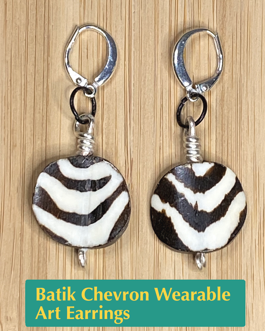 handmade earrings made of hand painted batik chevron striped Kenyan bone beads and black and white metal alloys.