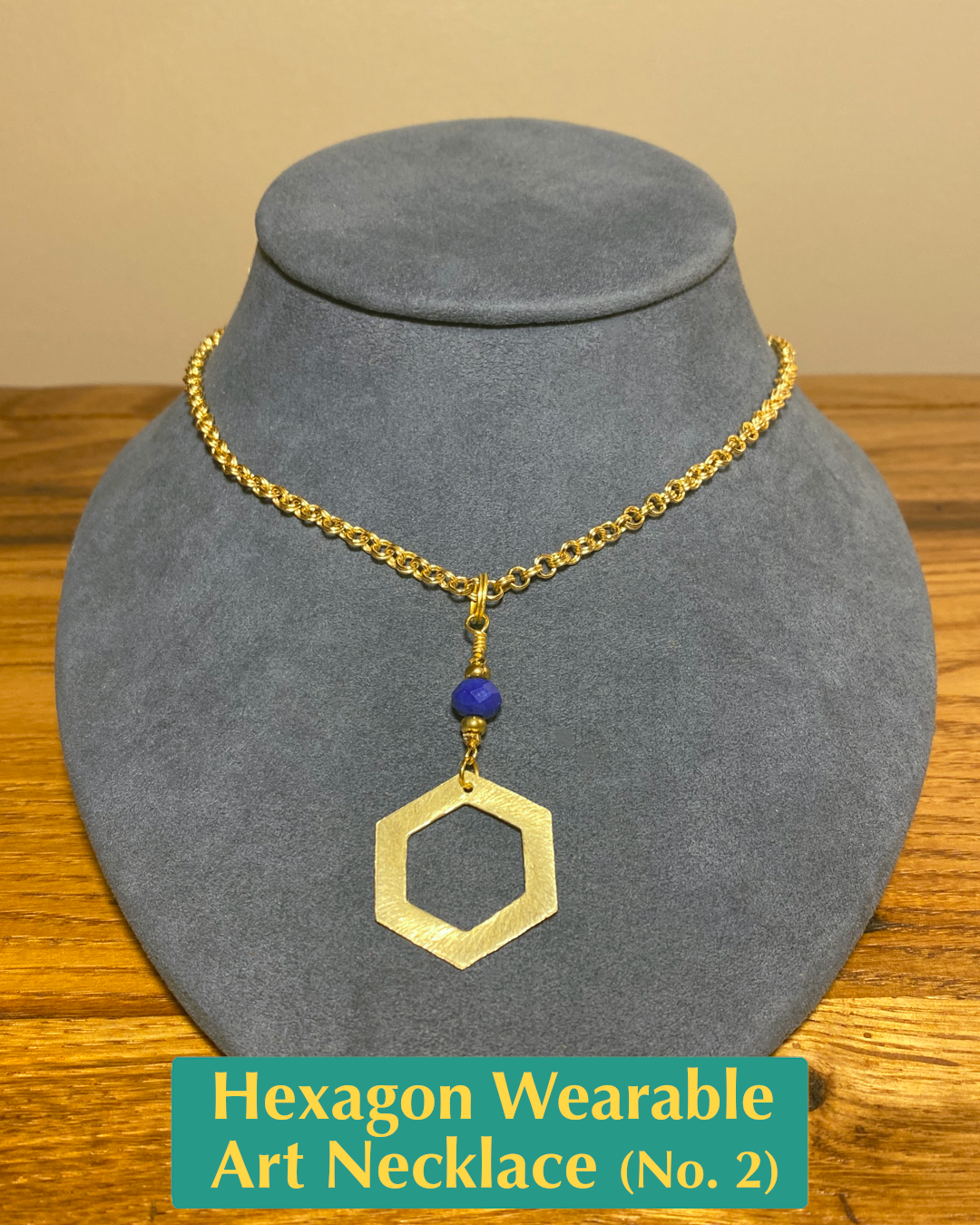 Handmade chain necklace with blue crystal and gold brass bead accents and a hexagon pendant