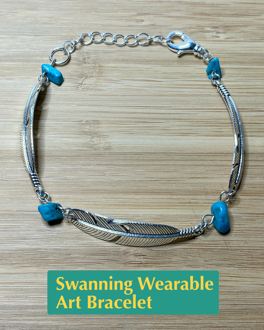 Handmade wearable art bracelet made from  silver tone feather charms and salvaged turquoise chip beads