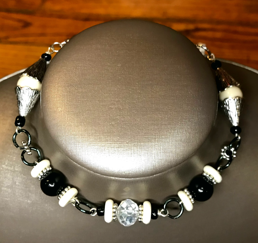 Handmade wearable art Malian Monochrome bracelet on display